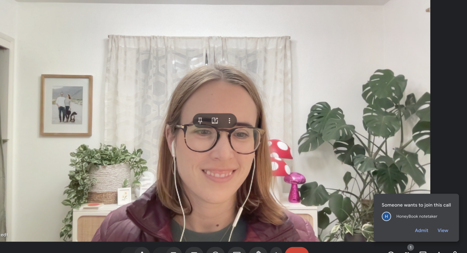 Screenshot of Sarah waiting on a video call and a pop up window showing that the Honeybook Notetaker wants to join the call.